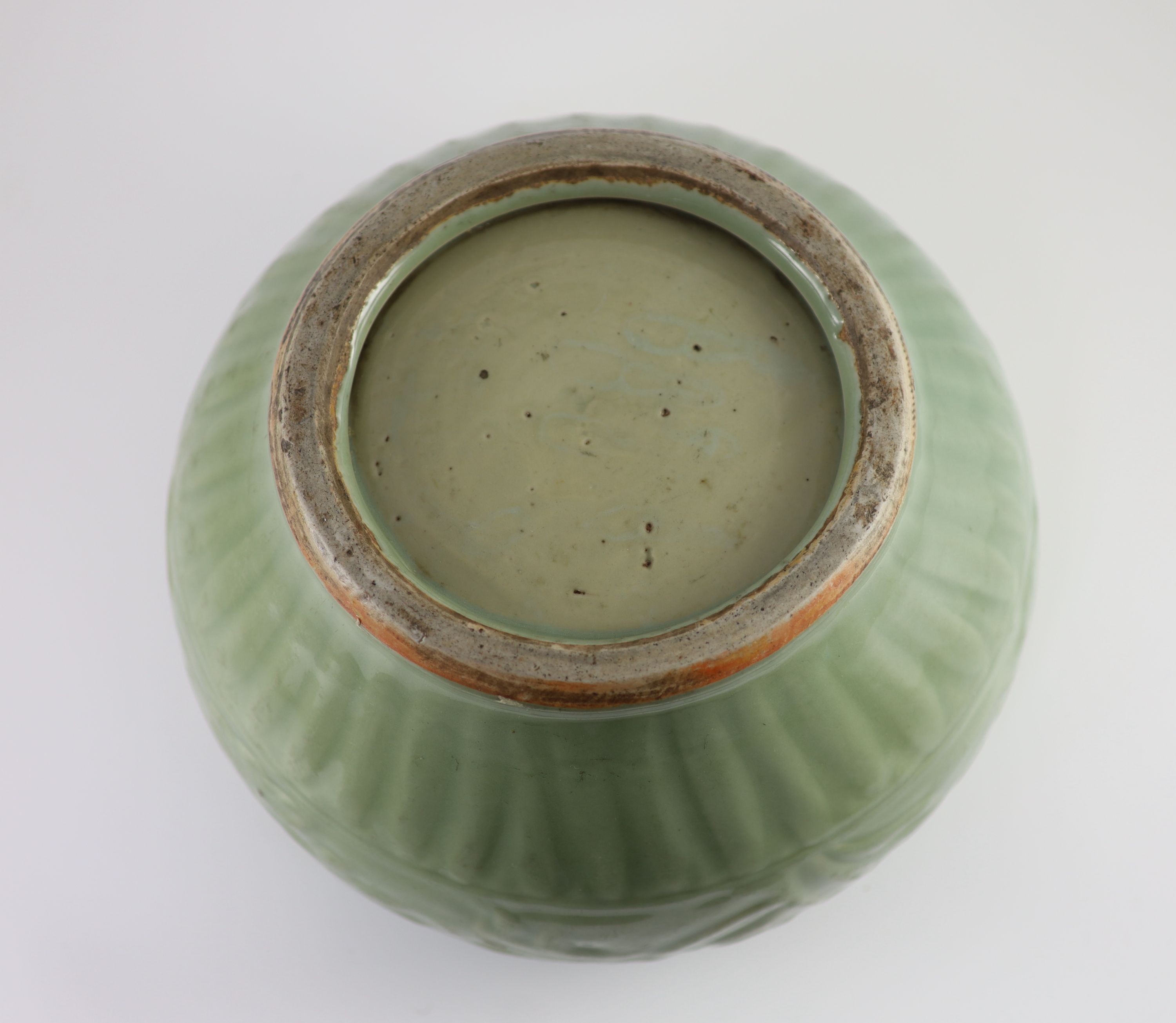 A large Chinese Longquan celadon jar, Guan, 14th century, 30.5 cm diameter, neck ground off